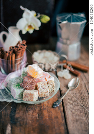 Turkish Delight - a gelatinous sweet confection traditionally made of syrup and cornflour, dusted with icing sugar. Still life food - oriental sweet rahat lokum . Candy marshmallow. 134058266