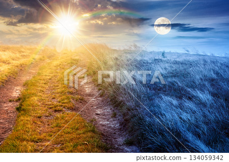 landscape with dirt road through field in fog in summer. day and night time change concept. yellow grass on the hills under sky with sun and moon. mystery atmosphere countryside composite photo landscape with dirt road through field in fog in summer. day and night time change concept. yellow grass on the hills under sky with sun and moon. mystery atmosphere countryside composite photo 134059342