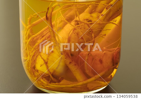 A bottle of medicinal liquor steeped in ginseng 134059538
