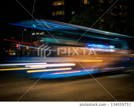 A highway bus passing by at night. Transportation 134059751
