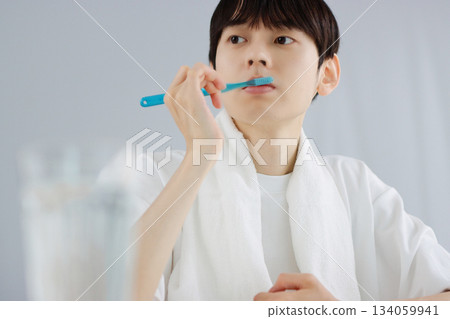 Oral care: A young man holding a toothbrush 134059941