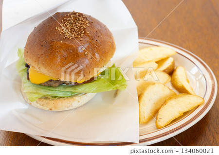 Delicious hamburger and french fries Delicious hamburger and french fries 134060021