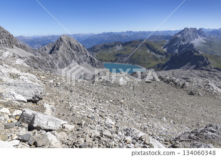 View from Schesaplana mountain showing Lunersee lake and Totalp-Hutte in Ratikon range in Vorarlberg, Austria View from Schesaplana mountain showing Lunersee lake and Totalp-Hutte in Ratikon range in Vorarlberg, Austria 134060348