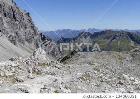 View from Schesaplana overlooking Totalpsee lake and Totalp-Hutte in Ratikon mountain range of Vorarlberg, Austria on a clear day 134060351
