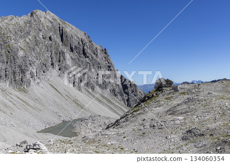 View from Schesaplana showing Totalpsee lake and Totalp-Hutte in Ratikon mountain range, Vorarlberg, Austria View from Schesaplana showing Totalpsee lake and Totalp-Hutte in Ratikon mountain range, Vorarlberg, Austria 134060354