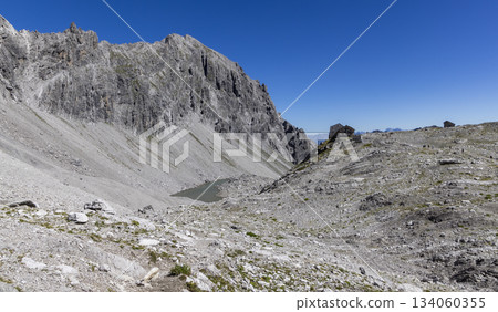 View from Schesaplana shows Totalpsee lake and Totalp-Hutte in Ratikon mountain range of Vorarlberg, Austria during daytime View from Schesaplana shows Totalpsee lake and Totalp-Hutte in Ratikon mountain range of Vorarlberg, Austria during daytime 134060355