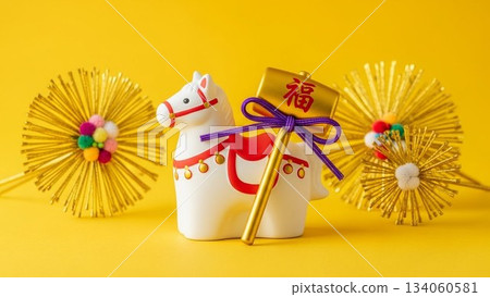 New Year's styling photo of rabbit figurines and mizuhiki decorations lined up against a yellow background New Year's styling photo of rabbit figurines and mizuhiki decorations lined up against a yellow background 134060581