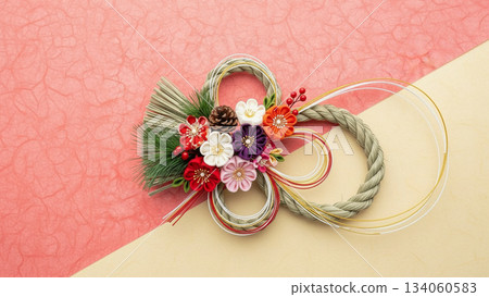 A gorgeous Japanese New Year's decoration photo of a Mizuhiki wreath placed on a pink background A gorgeous Japanese New Year's decoration photo of a Mizuhiki wreath placed on a pink background 134060583