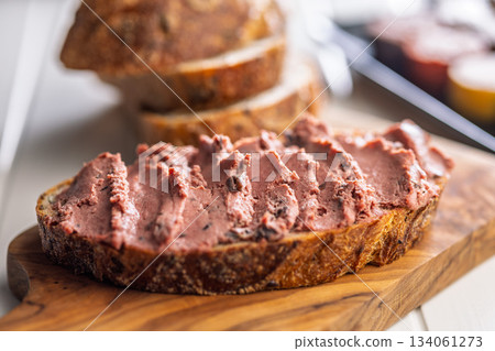 Pate on a slice of bread on white table. 134061273