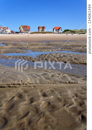Beautiful seaside beach house on waterfront promenade at the coastal village, West Flanders, sunny summer day, De Haan, Belgium Beautiful seaside beach house on waterfront promenade at the coastal village, West Flanders, sunny summer day, De Haan, Belgium 134061494