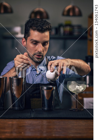 Bartender pouring ingredients Bartender pouring ingredients 134061743