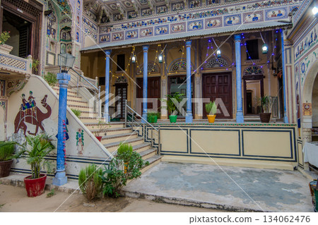 India, courtyard of a haveli with frescoes and blue columns in Mandawa 134062476