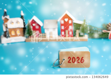 Notes 2026 with house and Christmas tree. Happy New Year or Xmas winter holiday. Decoration, celebration. The concept of the beginning of the new year. Snow, snowfall 134062649