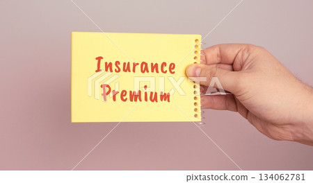 Insurance premium written on notes. Amount of money an individual or business pays for an insurance policy. Business and finance concept 134062781