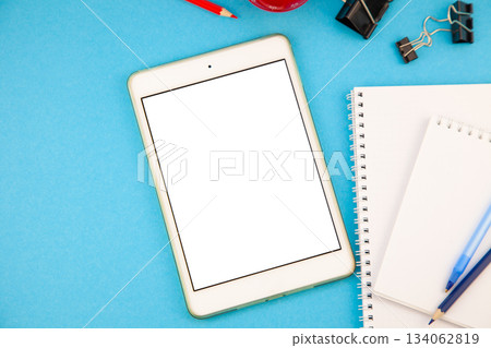 Tablet mockup background top view. Workplace copy space. otepad, notebook and pen. Study and work. Planning. Self-learning. Online course. Education remotely. Tablet mockup background top view. Workplace copy space. otepad, notebook and pen. Study and work. Planning. Self-learning. Online course. Education remotely. 134062819