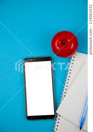Mobile phone mockup background top view. Workplace copy space. Notepad, notebook and pen. Study and work. Planning. Self-learning. Online course. Education remotely. Cellphone Mobile phone mockup background top view. Workplace copy space. Notepad, notebook and pen. Study and work. Planning. Self-learning. Online course. Education remotely. Cellphone 134062832