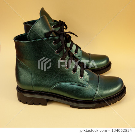 Green boots. Casual shoes classic. Leather modern boots. Boot with laces. Women's winter boot. Shoe. Green boots. Casual shoes classic. Leather modern boots. Boot with laces. Women's winter boot. Shoe. 134062834
