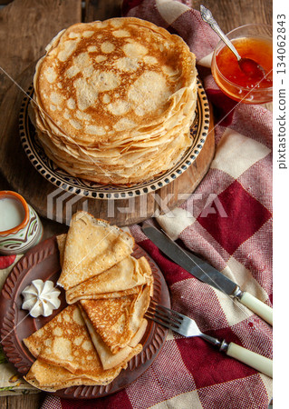 Thin pancakes. Floury food. Breakfast on the table. Thin pancakes. Floury food. Breakfast on the table. 134062843