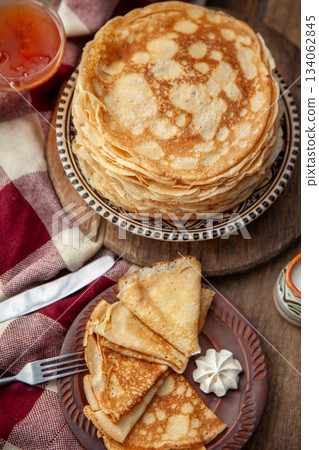 Thin pancakes. Floury food. Breakfast on the table. Thin pancakes. Floury food. Breakfast on the table. 134062845