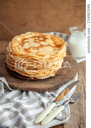 Thin pancakes. Floury food. Breakfast on the table. 134062846