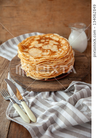 Thin pancakes. Floury food. Breakfast on the table. 134062849