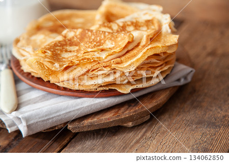Thin pancakes. Floury food. Breakfast on the table. 134062850