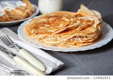 Thin pancakes. Floury food. Breakfast on the table. 134062853