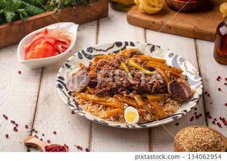 Traditional pilaf with meat and vegetables Traditional pilaf with meat and vegetables 134062954