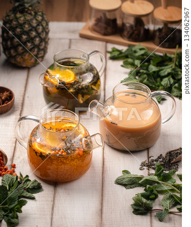 Assorted tea beverages in glass teapots Assorted tea beverages in glass teapots 134062967