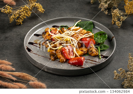 Glazed chicken stir fry with peppers plate Glazed chicken stir fry with peppers plate 134062984