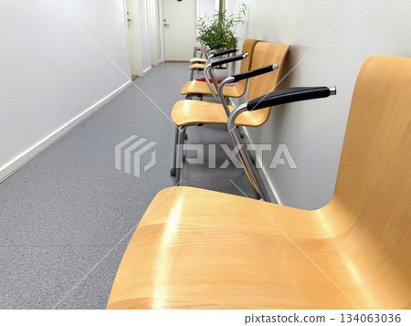 Narrow hallway with chairs in waiting area Narrow hallway with chairs in waiting area 134063036