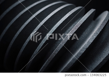 Spiral textured surface with contrasting light and shadows in dark setting Spiral textured surface with contrasting light and shadows in dark setting 134063225