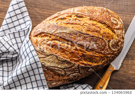 Loaf of bread on wooden table. Top view. Loaf of bread on wooden table. Top view. 134063968