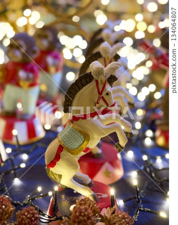 Circus style Christmas holiday figurines with horse and monkeys. Festive nostalgia, childhood memories and playful seasonal decoration. Circus style Christmas holiday figurines with horse and monkeys. Festive nostalgia, childhood memories and playful seasonal decoration. 134064807