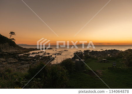 Sagami Bay and the sunset sky stretching out beyond the reefs of Arasaki Park Sagami Bay and the sunset sky stretching out beyond the reefs of Arasaki Park 134064878