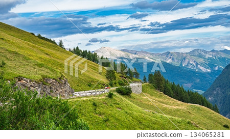 Austria Alps, Kaprun Picturesque Alpine Pass Road in Mountains and Lush Green Hills Austria Alps, Kaprun Picturesque Alpine Pass Road in Mountains and Lush Green Hills 134065281