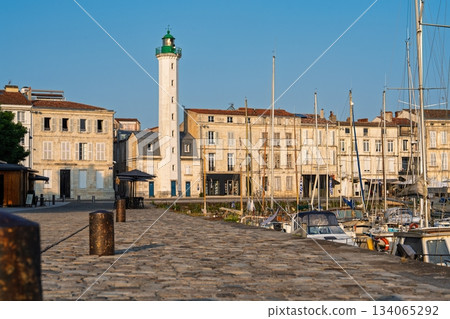 Picturesque La Rochelle Lighthouse and Harbor Buildings on a Sunny Day in Nouvelle-Aquitaine Picturesque La Rochelle Lighthouse and Harbor Buildings on a Sunny Day in Nouvelle-Aquitaine 134065292