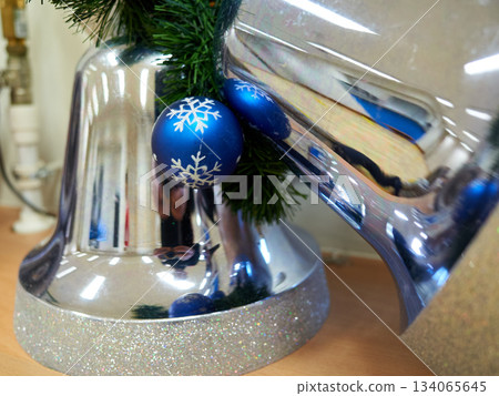 Seasonal display with shiny ornaments, Christmas window showcase with sparkling decorations and pine 134065645