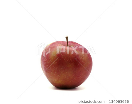 Vivid apple display, Vibrant red apple isolated against white background emphasizing freshness and quality 134065656
