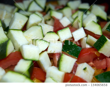 vivid image showing uniform vegetable cubes with glossy finish on stainless surface for culinary presentation 134065658