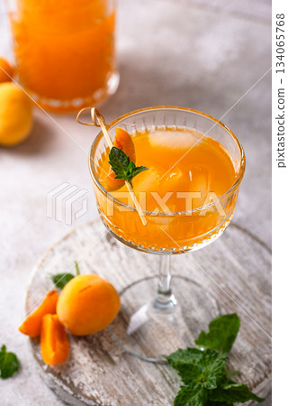 Fresh apricot Bellini cocktail with mint Fresh apricot Bellini cocktail with mint 134065768