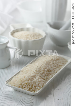 Raw organic rice in white dish. 134065828