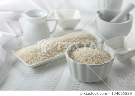 Raw organic rice in white dish. 134065829