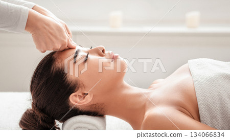 Young Asian Woman Receiving Professional Head And Face Massage At Spa Center, Relaxed Korean Female Enjoying Wellness Beauty Treatments And Body Care, Side View With Copy Space Young Asian Woman Receiving Professional Head And Face Massage At Spa Center, Relaxed Korean Female Enjoying Wellness Beauty Treatments And Body Care, Side View With Copy Space 134066834