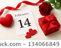 Valentines Day setup with calendar, rose, gift, and hearts. Romantic concept for love and celebration. 134066849