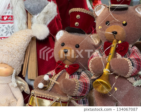 Two plush teddy bears dressed for Christmas with drum and trumpet. Friendship, childhood warmth, festive nostalgia and gentle winter magic Two plush teddy bears dressed for Christmas with drum and trumpet. Friendship, childhood warmth, festive nostalgia and gentle winter magic 134067087