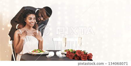 Amorous afro man giving his pretty woman elegant necklace as present for Valentine's Day, restaurant interior, empty space Amorous afro man giving his pretty woman elegant necklace as present for Valentine's Day, restaurant interior, empty space 134068071