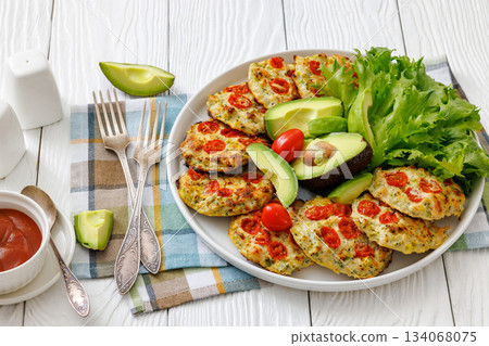 minced chicken cherry tomatoes patties on a plate minced chicken cherry tomatoes patties on a plate 134068075