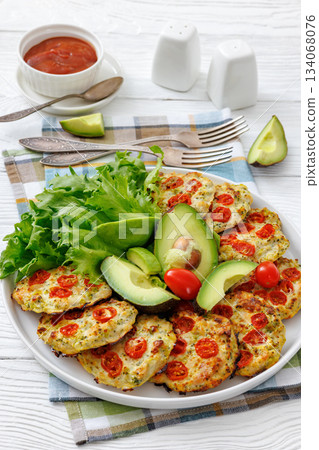 minced chicken cherry tomatoes patties on a plate minced chicken cherry tomatoes patties on a plate 134068076