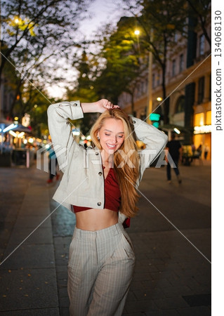 Pretty young woman enjoying evening walk in Vienna 134068130
